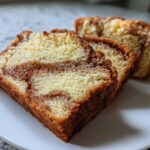 Three slices of moist cinnamon bread showing beautiful swirls of cinnamon sugar filling.
