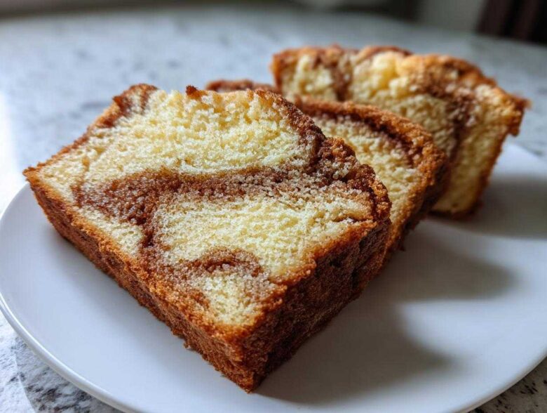 Three slices of moist cinnamon bread showing beautiful swirls of cinnamon sugar filling.