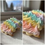Close-up of sugar cookies topped with piped, pastel rainbow sugar cookie icing that hardens.